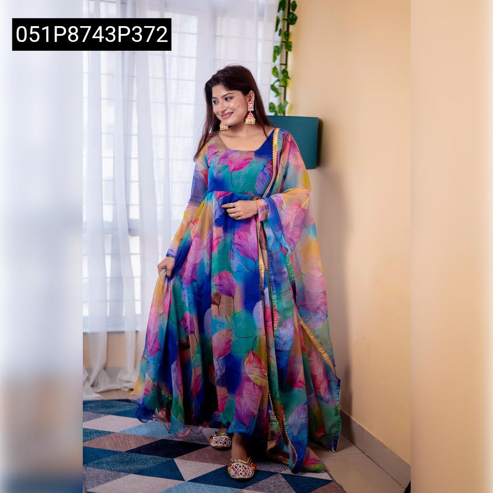 Full body shot of model wearing the TRENDBUY multi-color digital print organza gown with a matching dupatta, standing on a patterned rug.