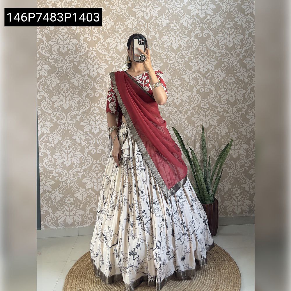TRENDBUY model in red and black digital print muslin silk lehenga choli with a solid red georgette dupatta, full view, showcasing the outfit's flair.