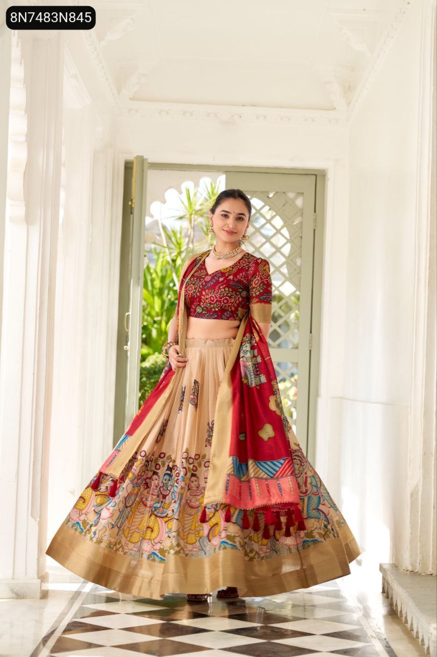 Model posing gracefully, showcasing a full view of the Red Kalamkari print blouse and dupatta with a Beige lehenga, wide flair, and gold border.