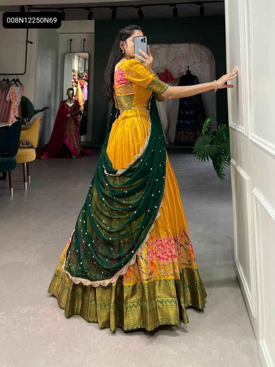 TRENDBUY Yellow Cotton Silk Lehenga Choli, side view, with dark green georgette dupatta and floral embroidered border.