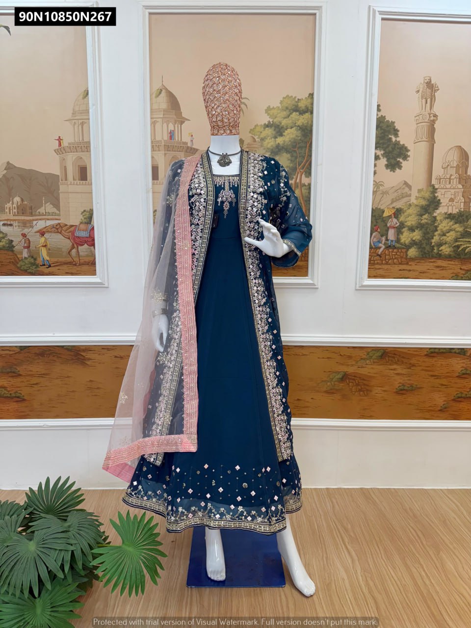 TRENDBUY Teal embroidered faux georgette gown set with koti and net dupatta on mannequin
