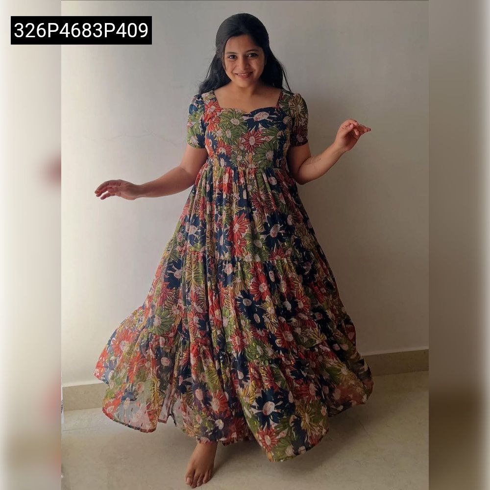TRENDBUY woman smiling in vibrant multi-color floral tiered maxi dress, full-body shot, dynamic pose.
