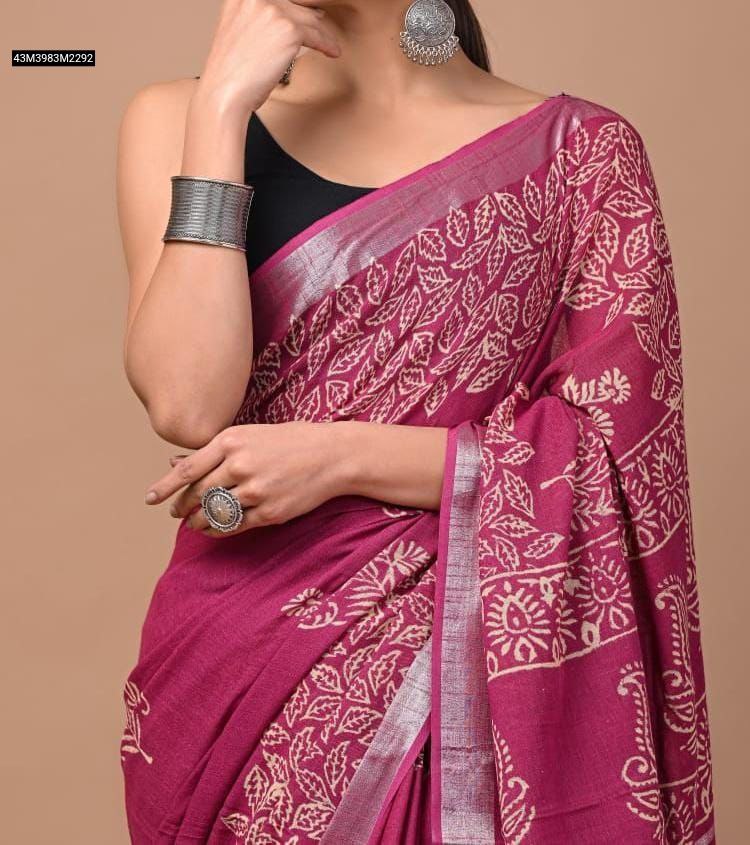Close-up of a TRENDBUY Magenta Linen Saree with flowing cream swirl digital prints and a silver zari border, highlighting the fabric texture and details.