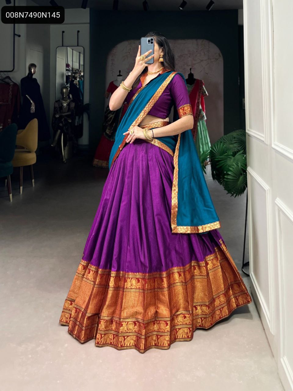 TRENDBUY Regal Purple Narayan Pet Lehenga Choli with Zari weaving, featuring a teal dupatta and gold jewelry, full body shot.