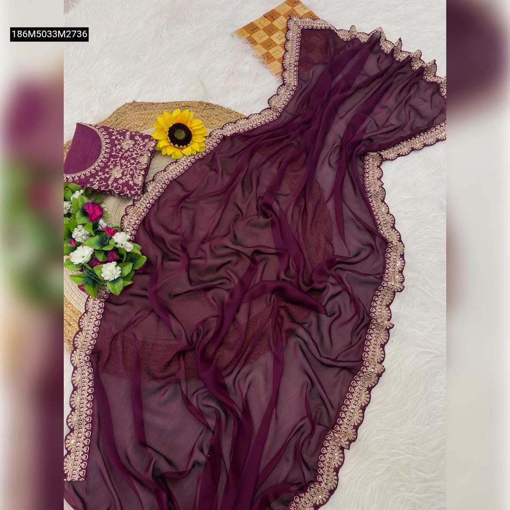 Plum sheer silk saree with golden scalloped lace border and matching embroidered blouse, flat lay on white faux fur with decor.