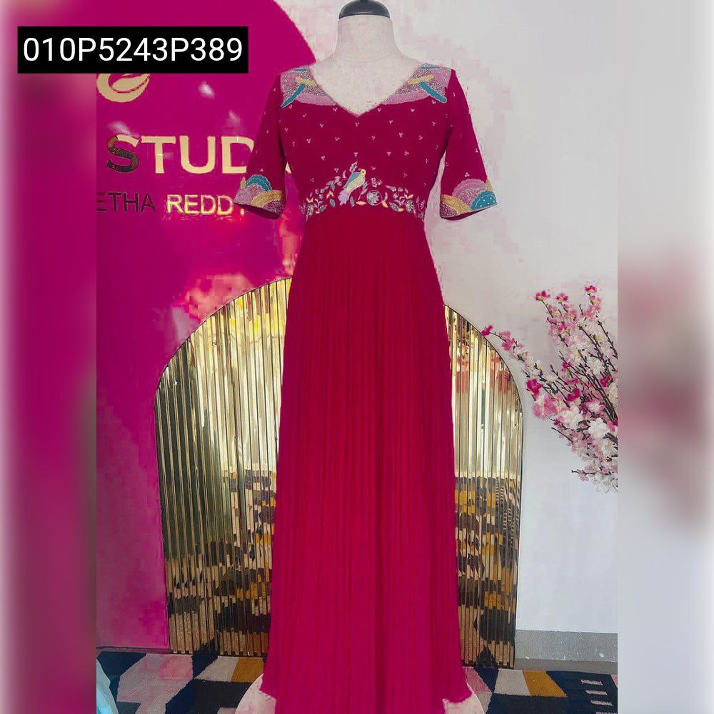 Full-body view of TRENDBUY fuchsia embroidered chinon silk gown on a mannequin, highlighting the pleated skirt and V-neckline.