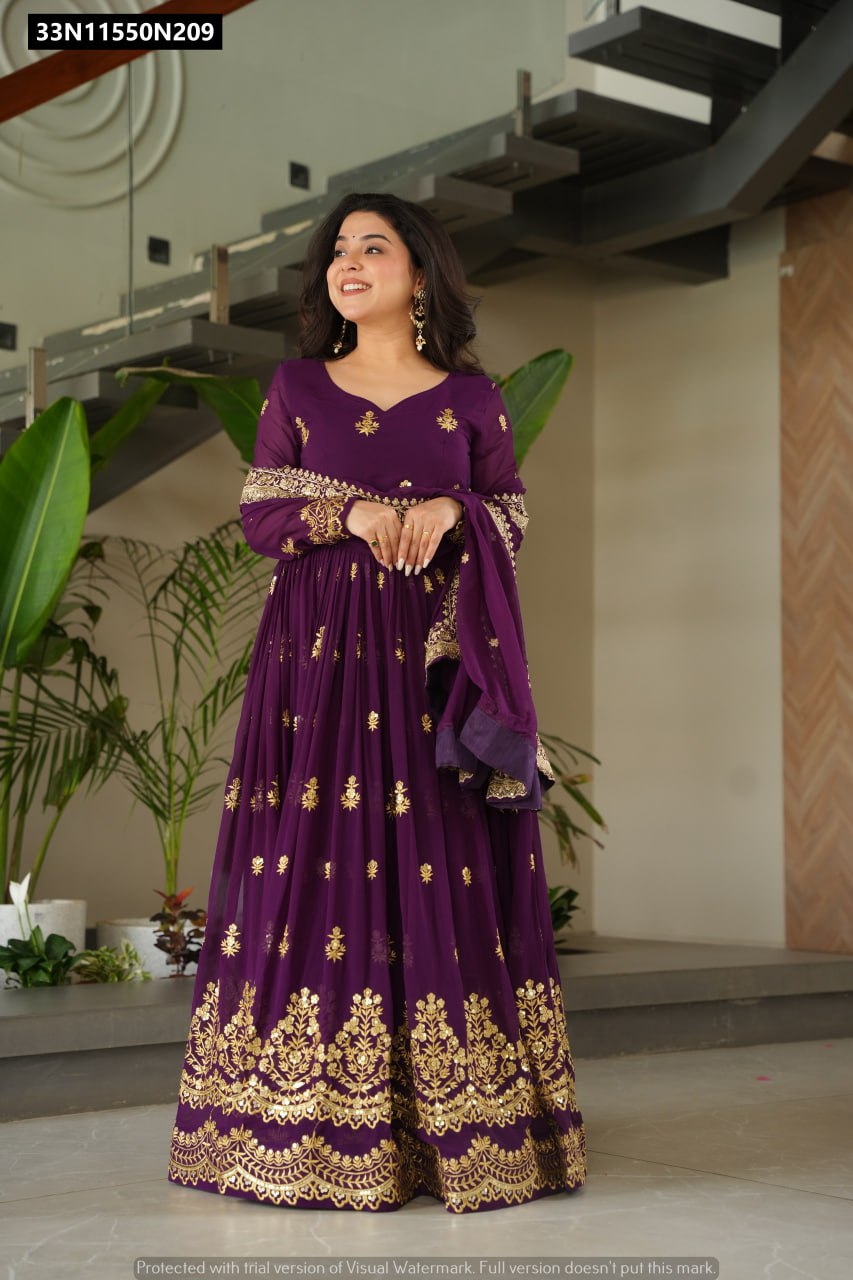 Model standing gracefully in a purple embroidered gown, with hands gently clasped, showing the full front view and elegance.