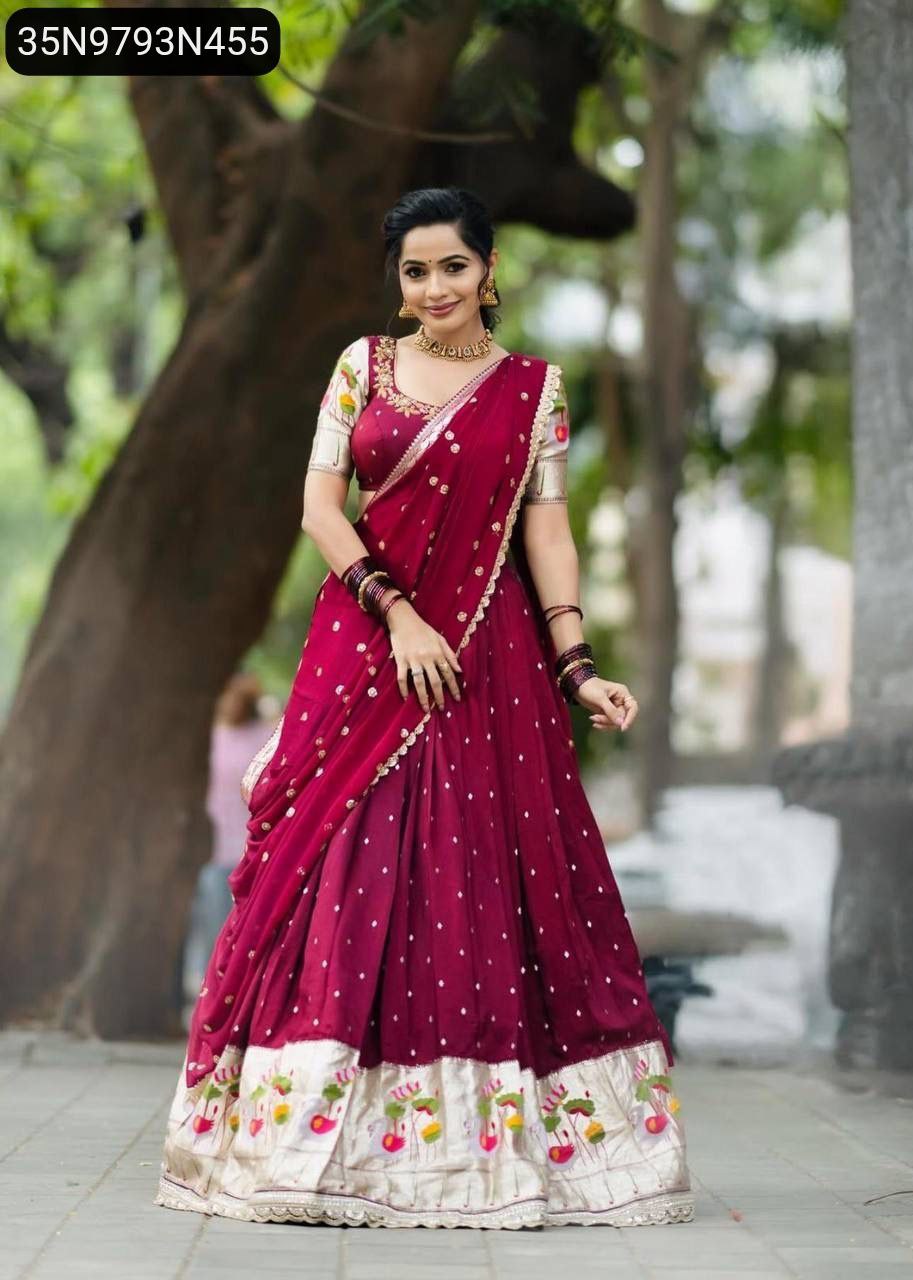 Full body shot of model showcasing TRENDBUY Red Embroidered Georgette Lehenga Choli with full flair and matching dupatta, standing outdoors.