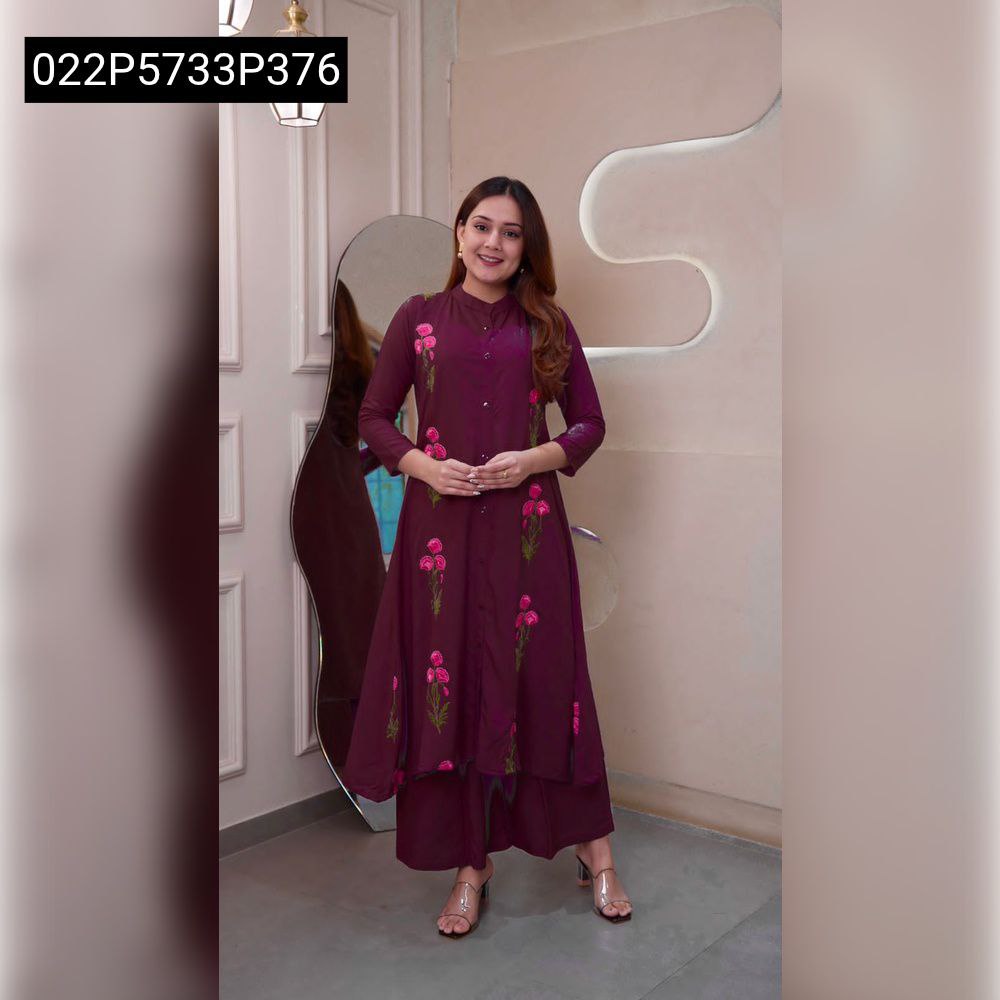 Full body shot of a smiling model wearing a gorgeous Wine TRENDBUY 14kg heavy Rayon kurti and palazzo set with pink floral embroidery.
