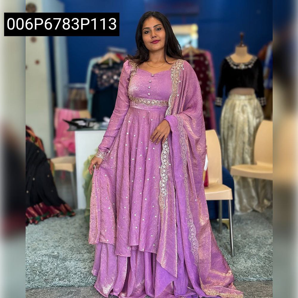 Model wearing TRENDBUY lavender embroidered Vichitra silk lehenga with a matching cape top and dupatta, showcasing the full ensemble.