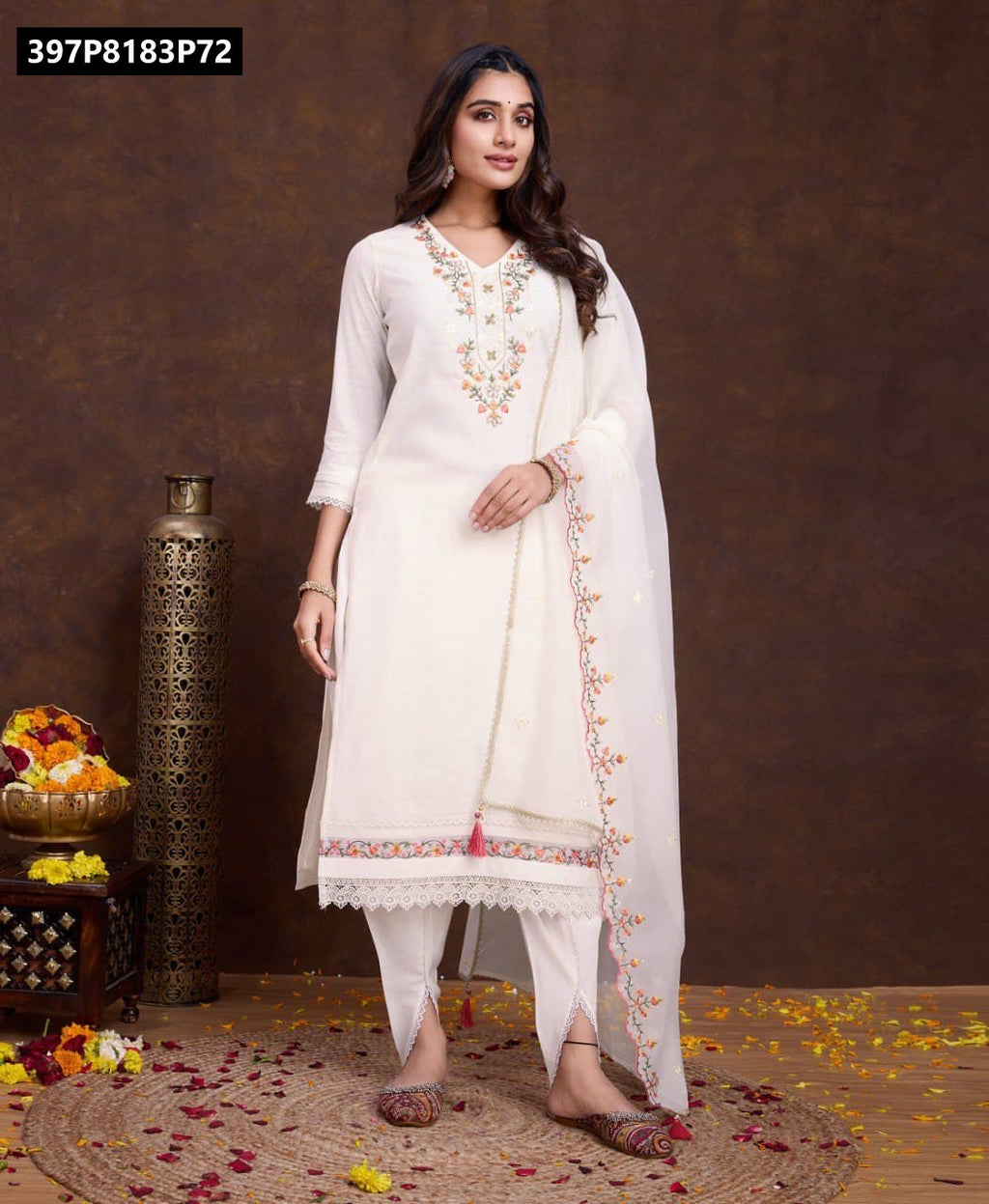 Full body front view of model confidently posing in the white embroidered viscose kurta set, featuring the floral embroidery, tulip style pants, and organza dupatta.
