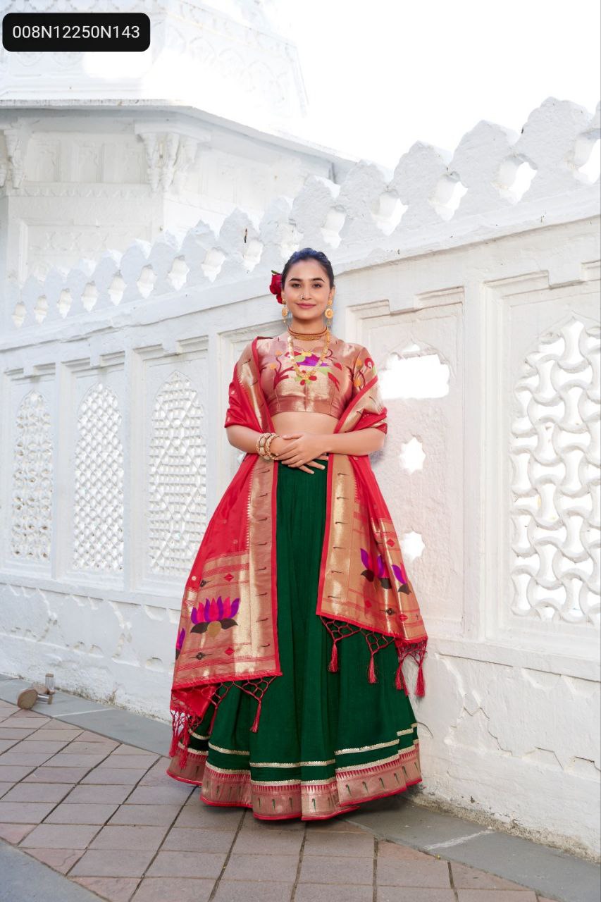 Front view of model wearing TRENDBUY Emerald Green Paithani Lehenga Choli, featuring gold zari blouse and vibrant red dupatta with floral motifs.