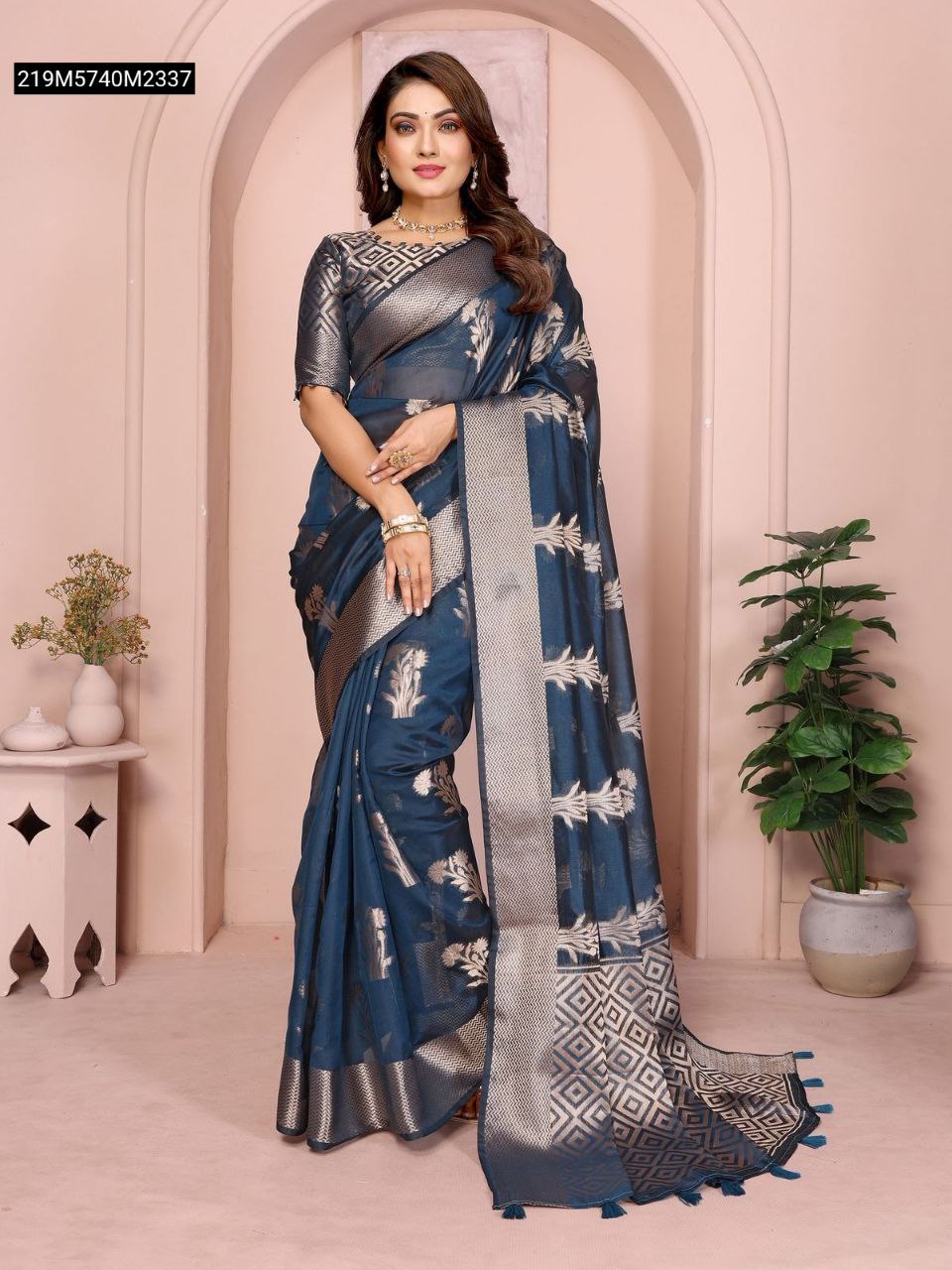 TRENDBUY Navy Blue Organza Silk Banarasi Saree, full model shot showcasing intricate butta weave and pallu tassels.