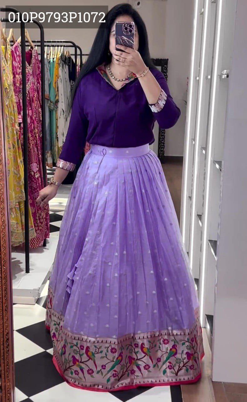 A woman wearing the TRENDBUY dark purple Roman silk blouse and a matching light purple organza lehenga choli set, featuring ornate Paithani daman work, captured in a mirror selfie.