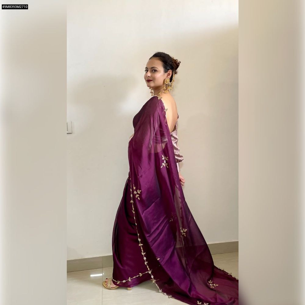 Rear-side view of model gracefully walking in the TRENDBUY Plum Rangoli Silk Saree, highlighting the flow and border craftsmanship.