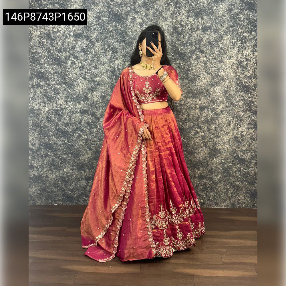 Elegant model in TRENDBUY Ruby Red Tissue Silk Lehenga Choli featuring detailed Zari work on skirt and blouse, with matching draped dupatta.