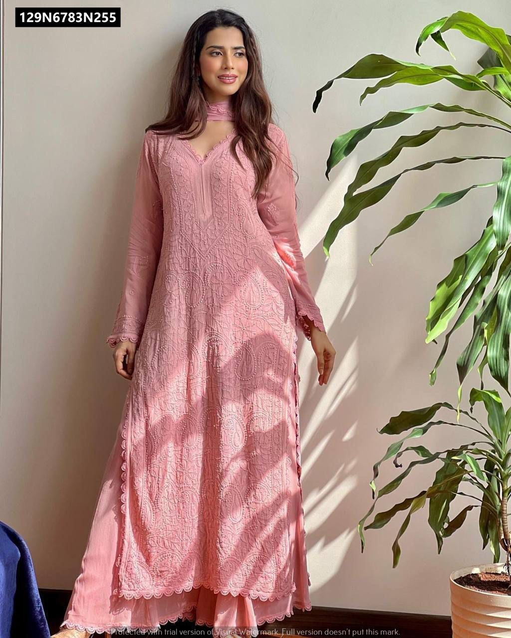 Model presenting the elegant light pink TRENDBUY Faux Georgette Kurta Plazo Dupatta set, with delicate embroidery.