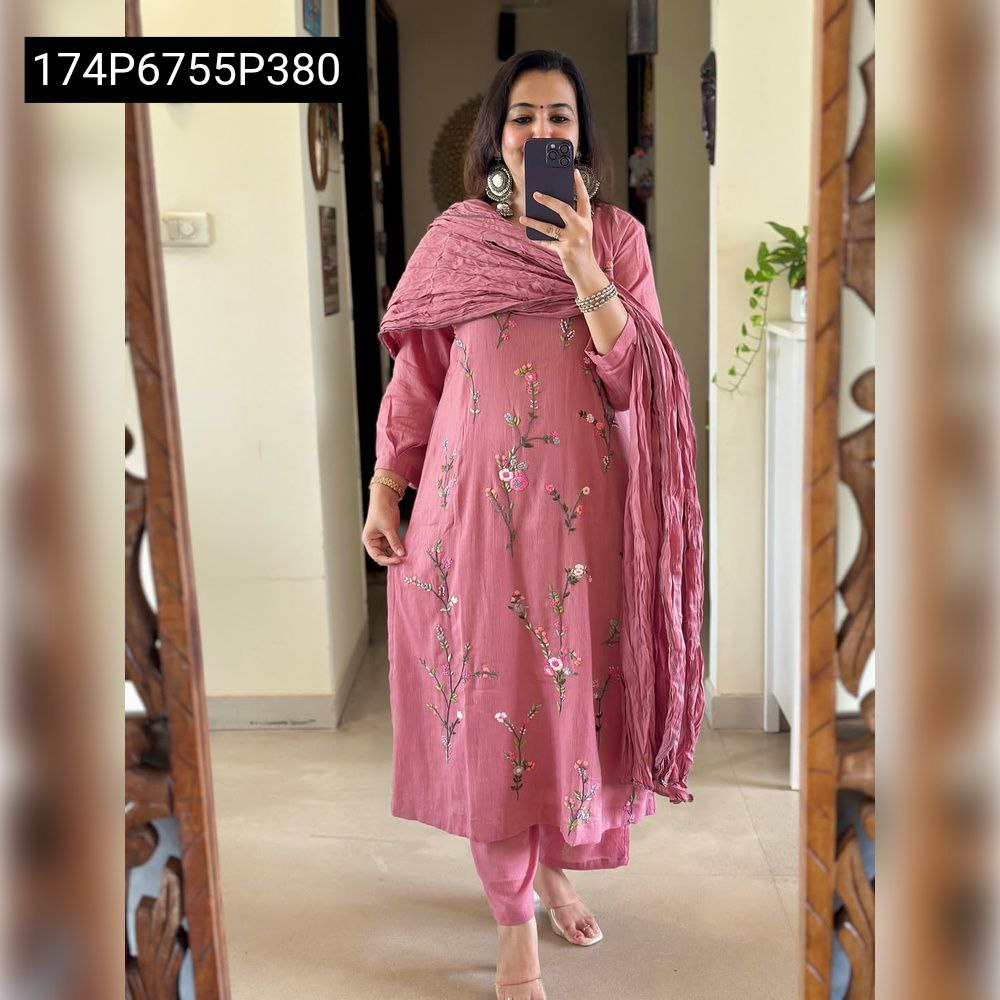 Model posing in a mirror, wearing a rose pink Mal Cotton kurta set with floral embroidery and a matching crinkled dupatta draped over her shoulder.