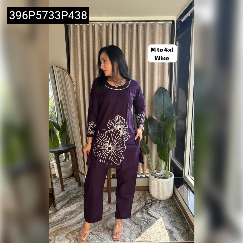 Full body shot of a model wearing a dark purple (wine) short top and plazo set with white floral embroidery, highlighting 'M to 4XL Wine' sizes.