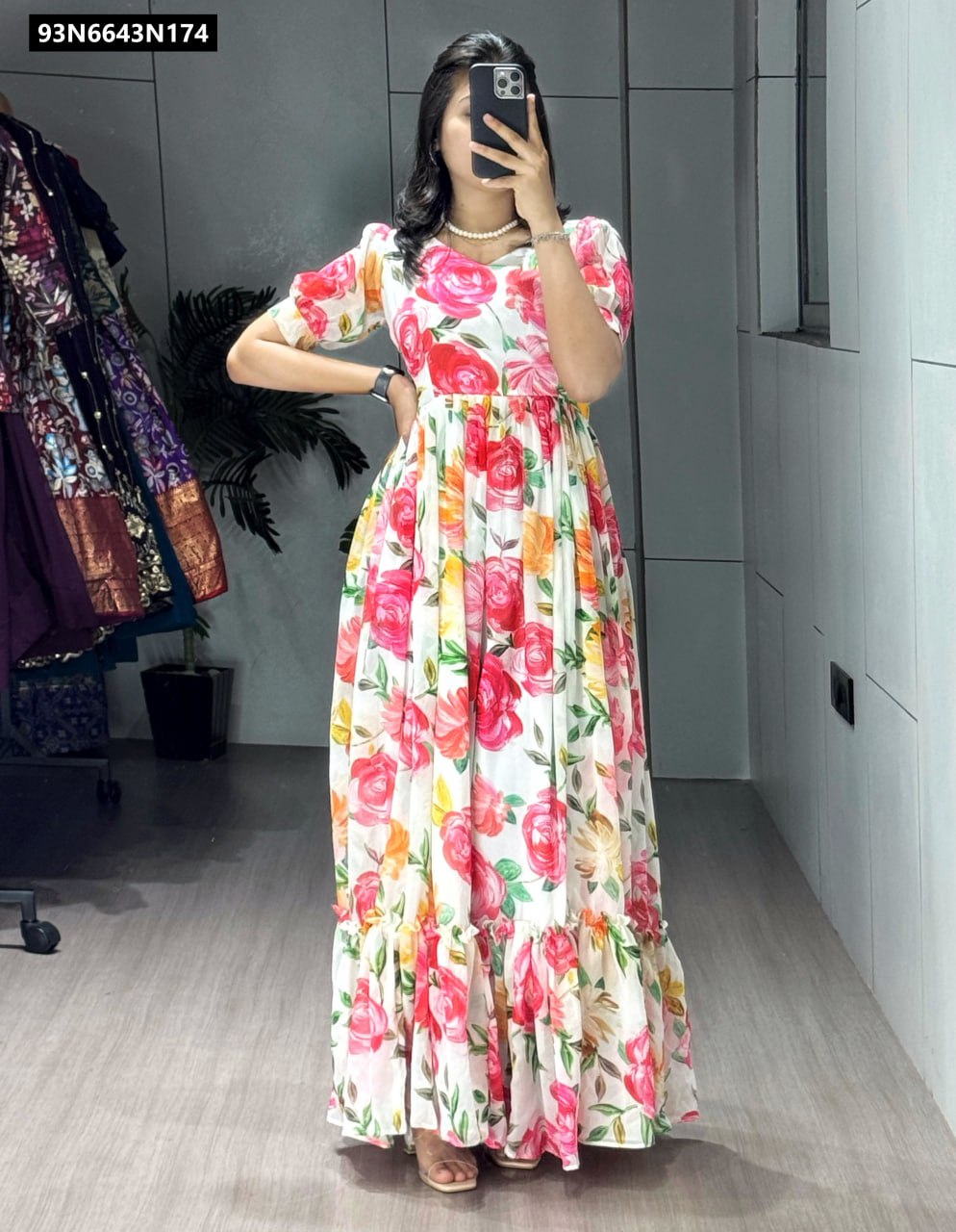 TRENDBUY model in a vibrant white multi-floral printed kurti with double frill patterns, posing elegantly.