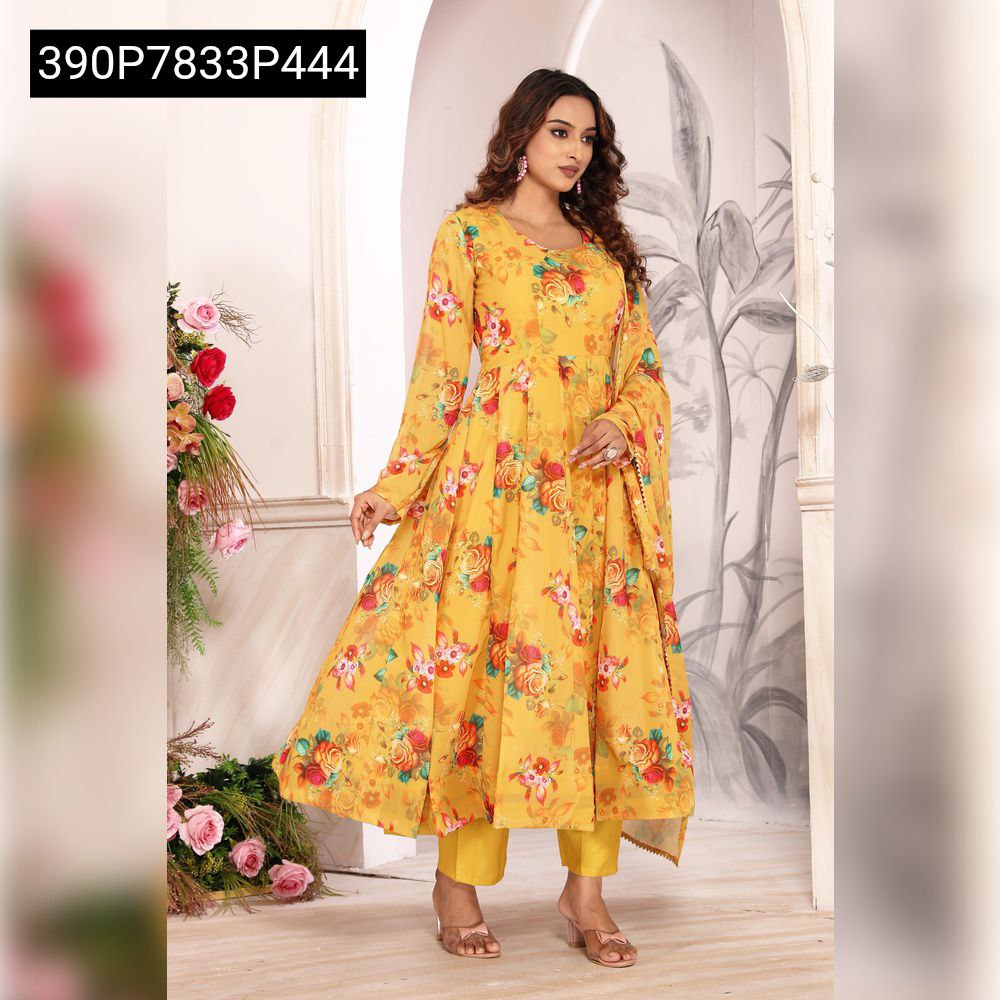 Full body shot of a model standing, wearing a yellow floral printed Anarkali suit with matching dupatta and pants.