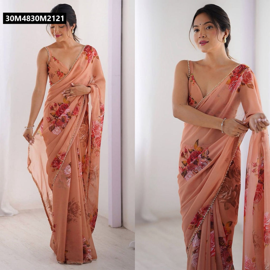Model gracefully posing in a TRENDBUY Peach Floral Georgette Silk Saree with delicate moti lace border