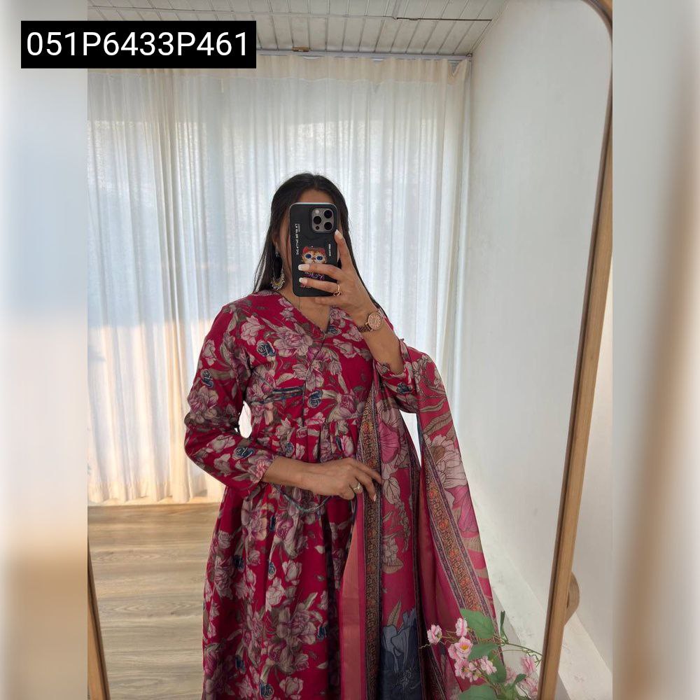 Full shot of a model in a red floral Roman silk Anarkali gown with matching digital print Simmar silk dupatta, reflected in a mirror.