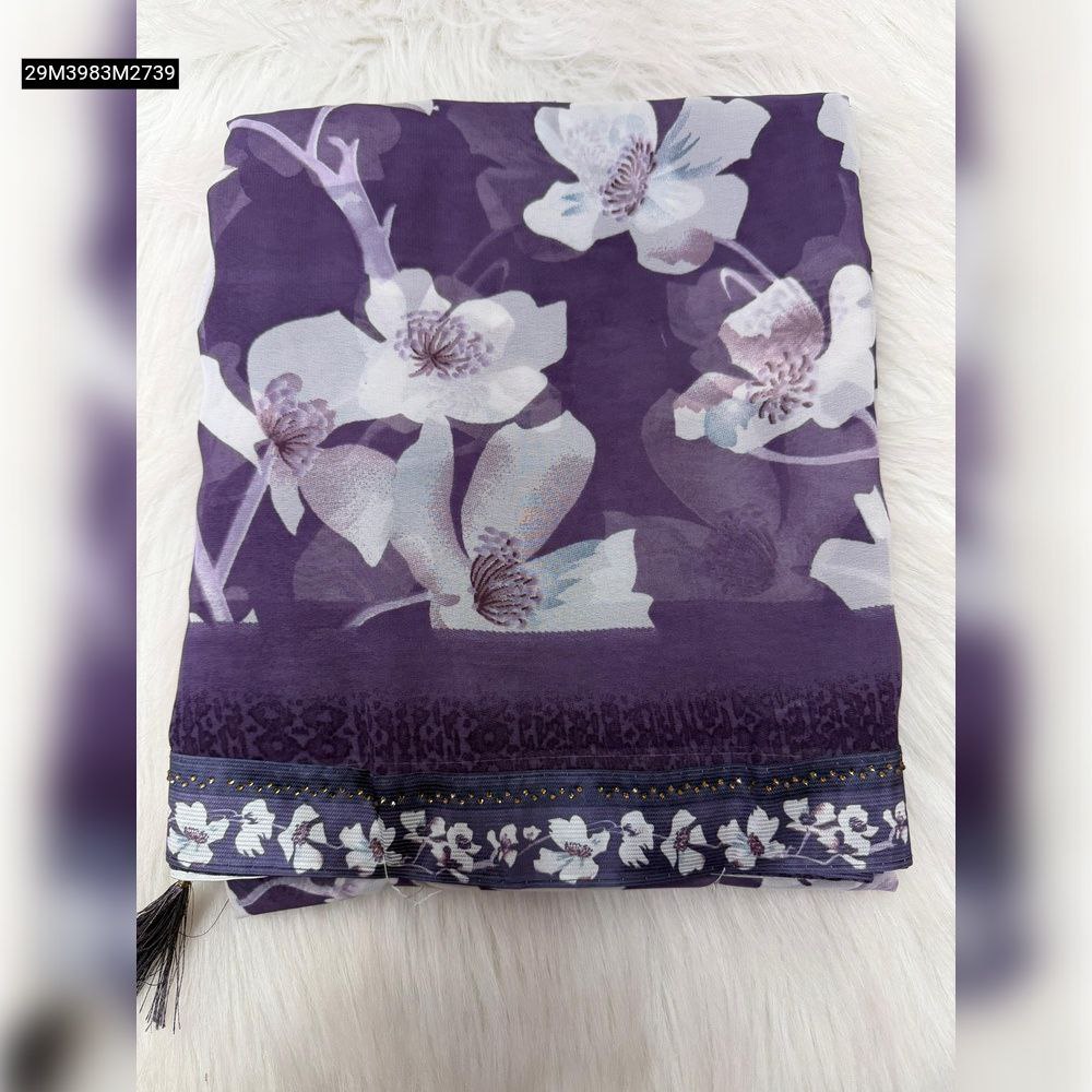 Close-up of vibrant pink and green digital floral print on lightweight georgette fabric