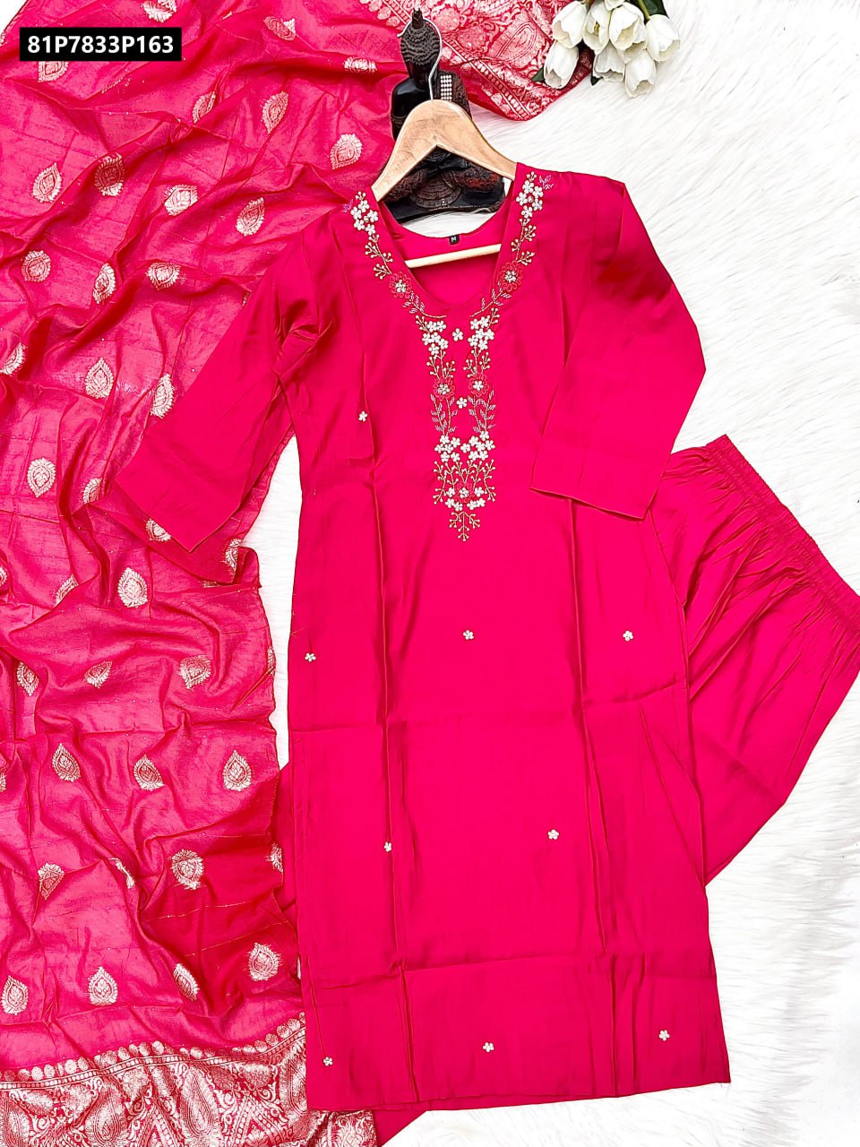 Full view of TRENDBUY Fuchsia pink kurti set with palazzo and golden motif Upara silk dupatta on a white fur rug, showcasing the entire ensemble.