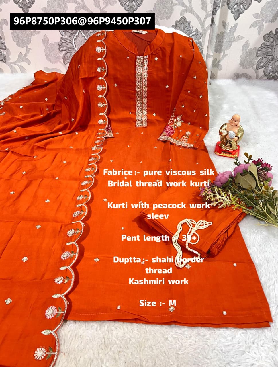 TRENDBUY orange pure Muslin Silk kurti, pant, and Chanderi silk dupatta set, featuring heavy embroidery and sequance work, draped gracefully on a white textured surface.