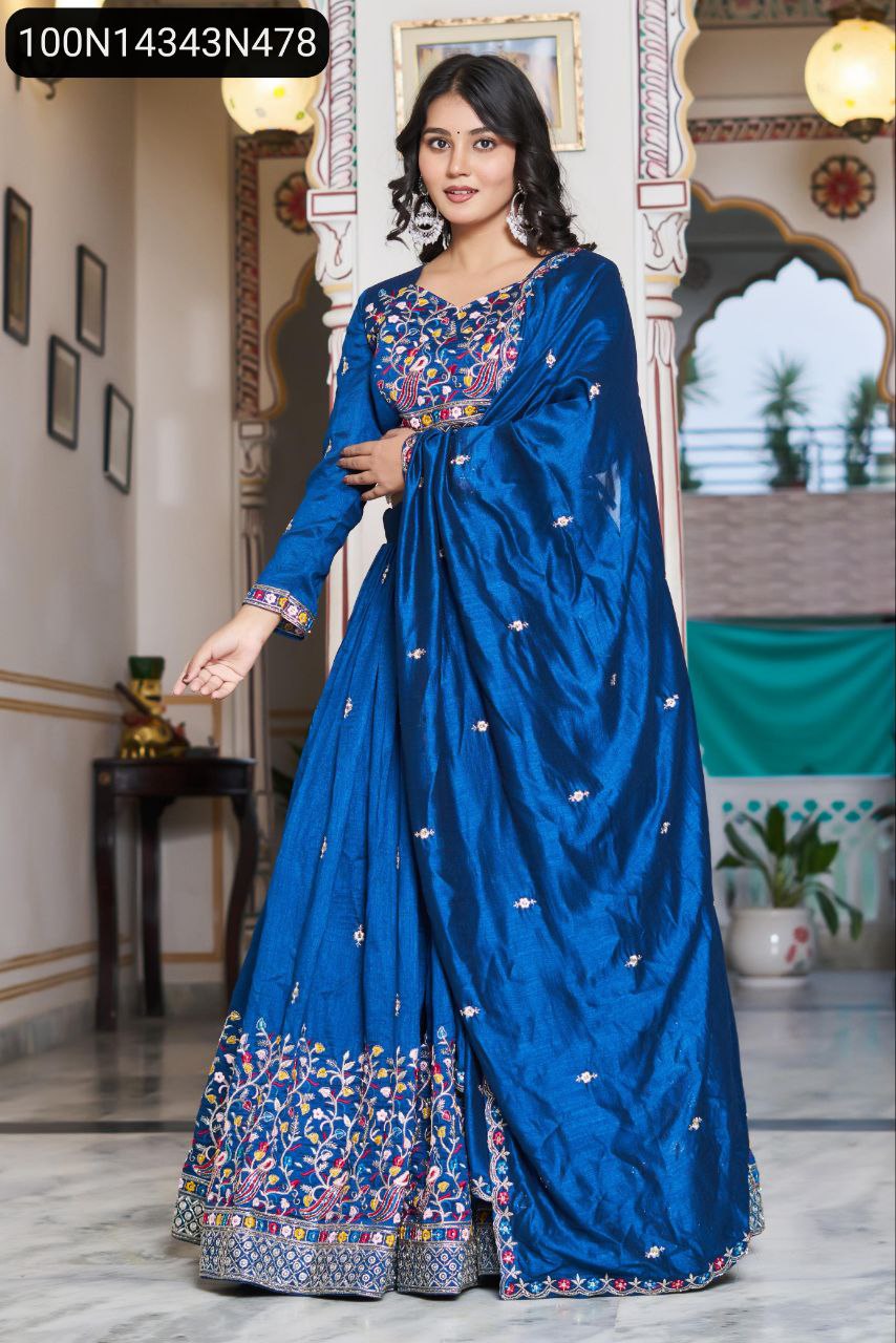 TRENDBUY Royal Blue Vichitra Silk Lehenga Choli with heavy embroidery and sequins, modelled elegantly with dupatta flowing.