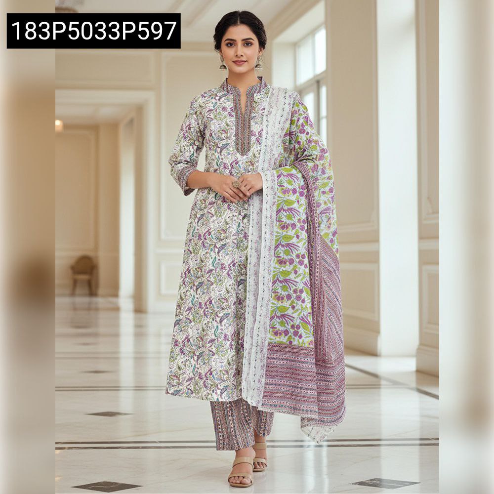 TRENDBUY woman in white Jaipuri printed cotton kurta set with purple-green floral print, standing in a luxurious hallway, front view.