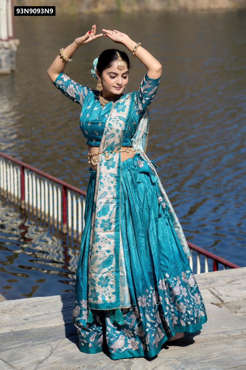 TRENDBUY model in vibrant Teal Blue Kalamkari Manipuri Silk Lehenga Set with printed dupatta, dancing by a lake with arms raised