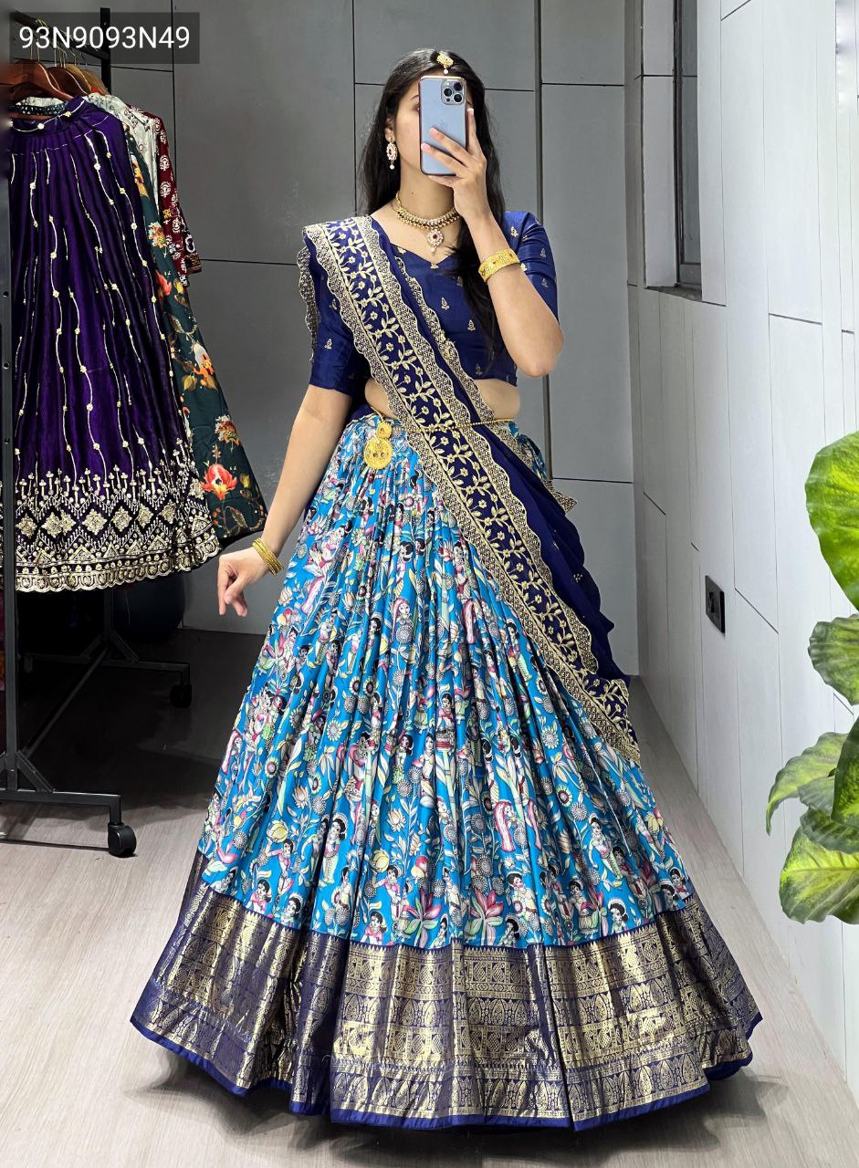 Full body shot of a model wearing the TRENDBUY Azure Blue Kalamkari Dola Silk Lehenga Choli with a navy blue blouse and embroidered Gorgette dupatta, showcasing the full flair and design in a vibrant setting.