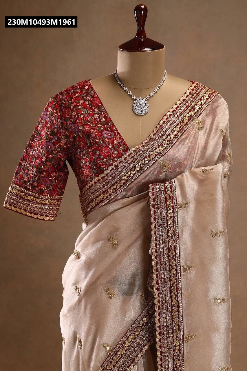 Close-up of TRENDBUY light gold jimichu saree and maroon embroidered blouse on mannequin, highlighting the zari work, sequence border, and neckline.