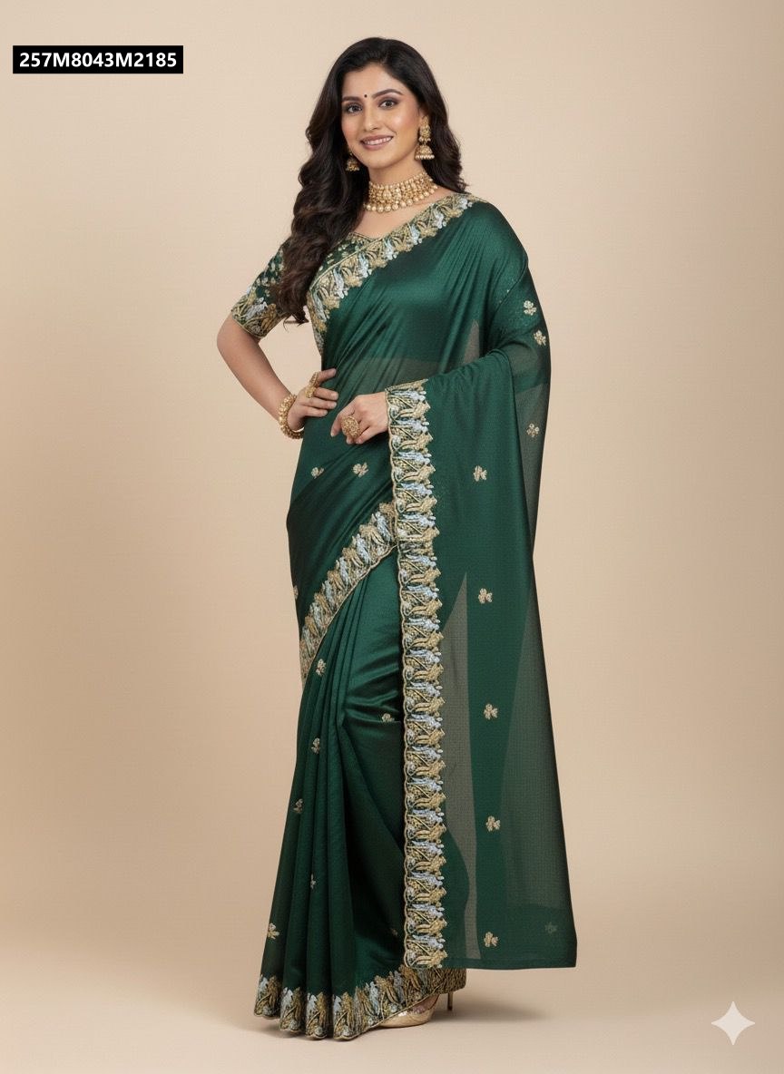 Model showcasing TRENDBUY dark green Fandy satin saree with silver-golden parrot embroidery and matching blouse.
