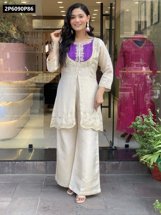 Model wearing TRENDBUY Roman Silk embroidered kurti and palazzo set in off-white with purple yoke, front full body shot.