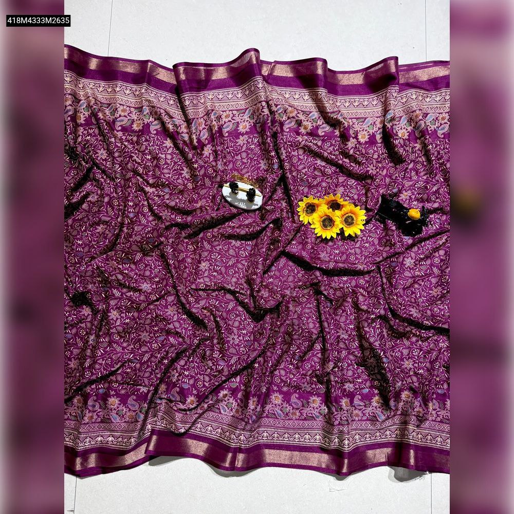 TRENDBUY Mangalagiri Mul Mul Cotton Saree in vibrant purple with intricate floral patterns and a weaving jacquard border, elegantly draped on a white surface with decorative items.