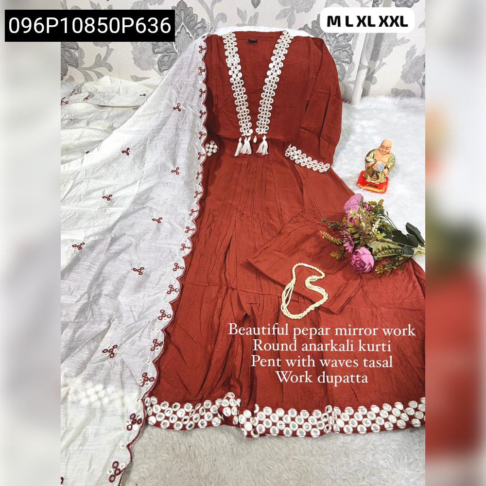 Full flat lay of a rust Mull Chanderi Anarkali kurti set with white embroidered dupatta, featuring pepar mirror work and tassels