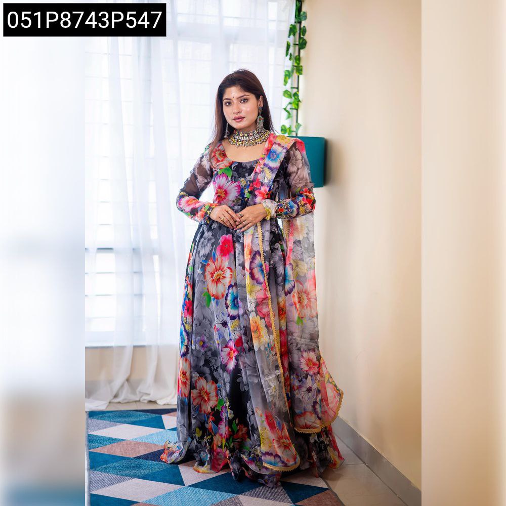Full body shot of a woman posing elegantly in a multi-color digital floral print organza silk gown with matching dupatta.