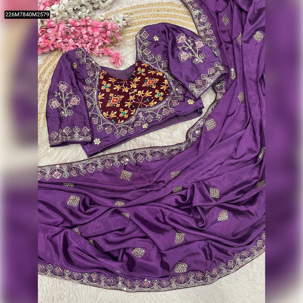 TRENDBUY Purple Chinnon Silk saree with all-over silver sequence work and elaborate lace border, paired with a matching embroidered designer blouse featuring multicolor patchwork.