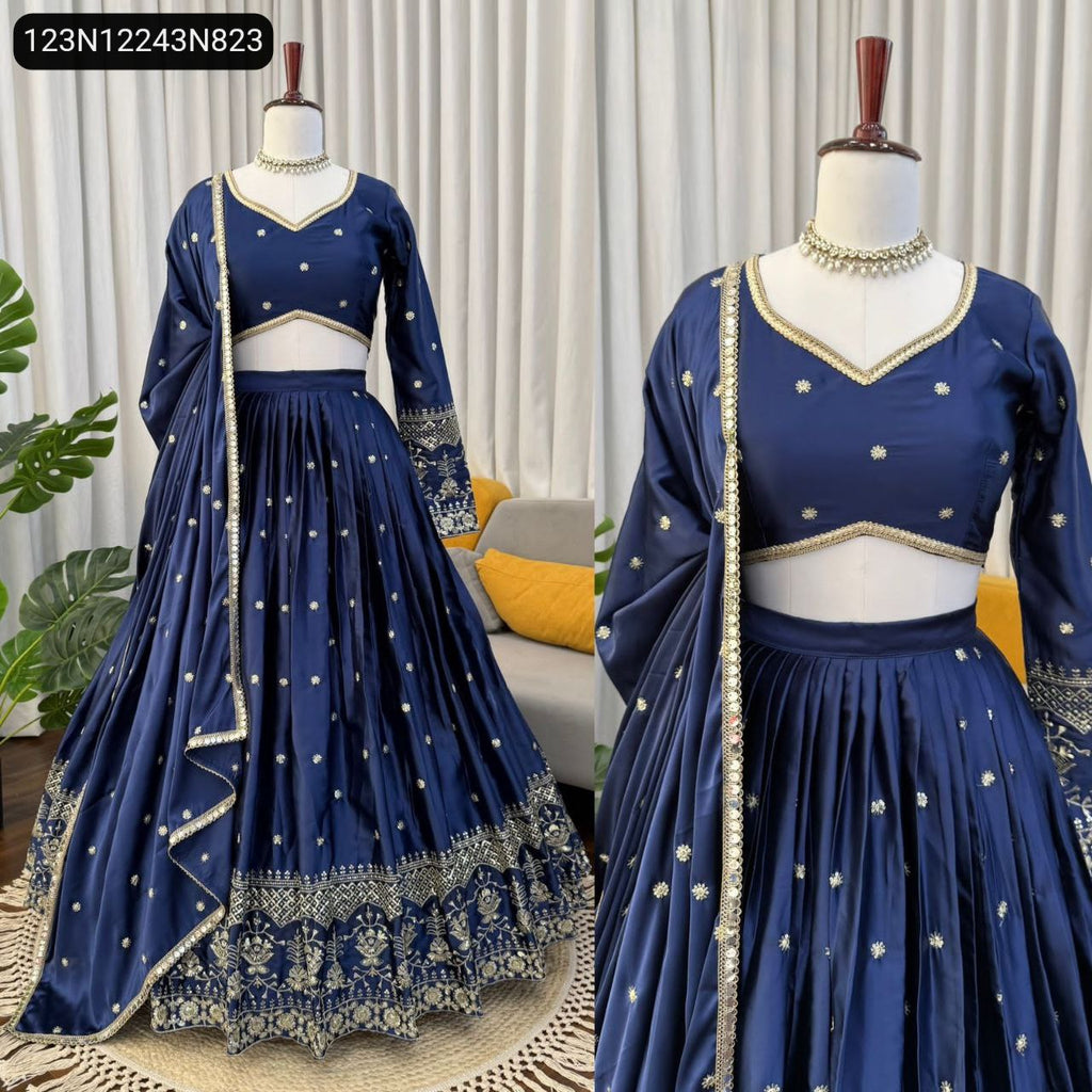 TRENDBUY Navy Blue Japan Satin Lehenga Choli with full sleeves blouse and dupatta, featuring intricate thread and sequin embroidery on a mannequin.