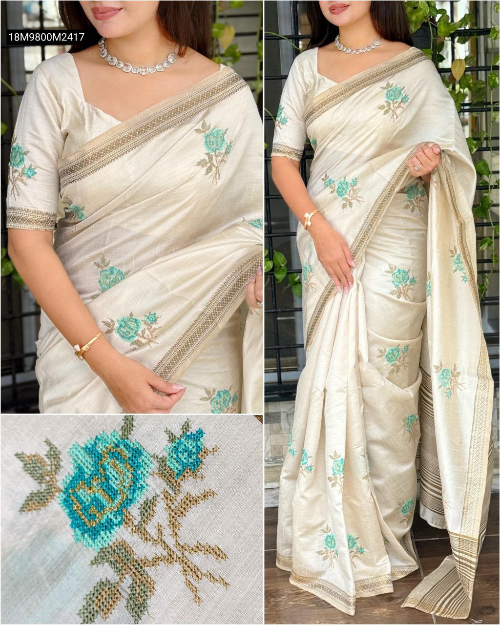 TRENDBUY Off-White Pure Tusser Silk Saree on model, featuring teal Kashmiri embroidery and a golden zari border, styled with a matching blouse and silver necklace.
