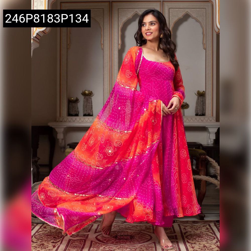 TRENDBUY Ombre Bandhani Georgette Gown and Dupatta set, vibrant pink and orange, worn by model in a full body dynamic pose, indoors.