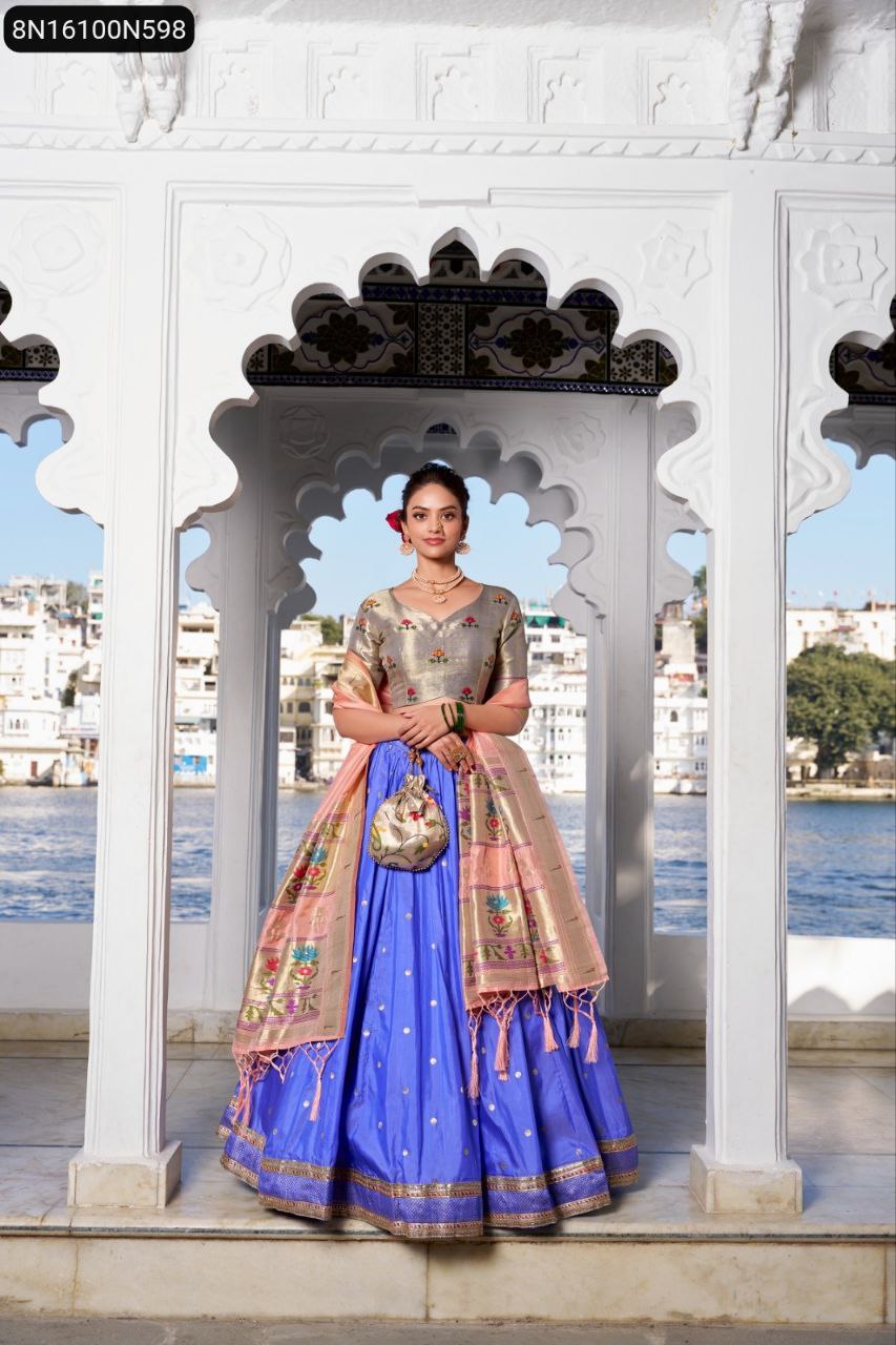 Full body shot of model standing in a TRENDBUY Paithani royal blue lehenga, grey blouse, and peach dupatta with ornate zari weaving, showcasing the complete traditional Indian outfit with matching batwa.