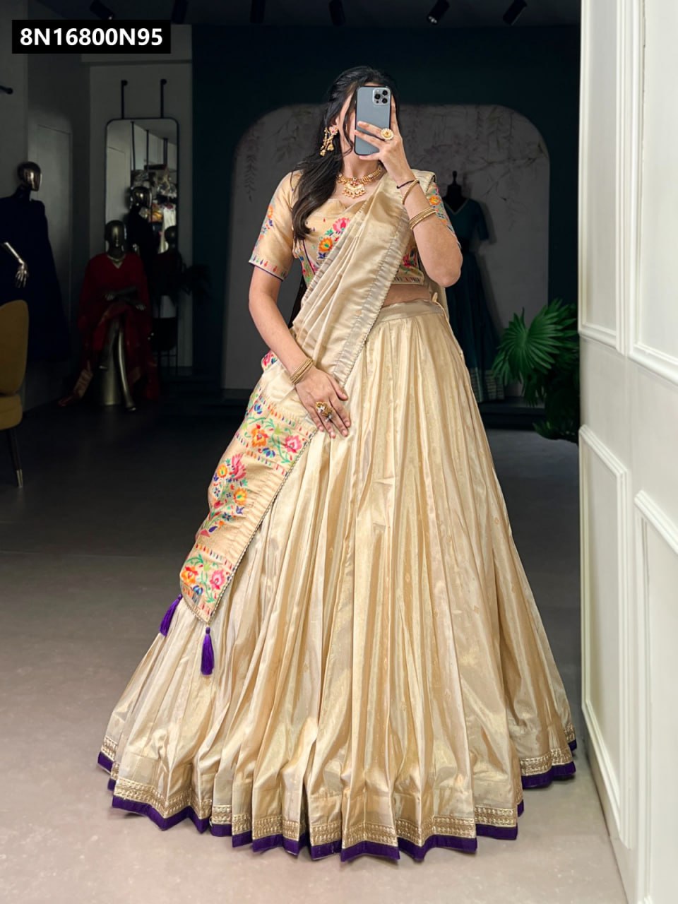 Full shot of model wearing TRENDBUY Paithani-style shimmer lehenga choli with purple border and tassels, elegant zari weaving visible on dupatta and blouse.