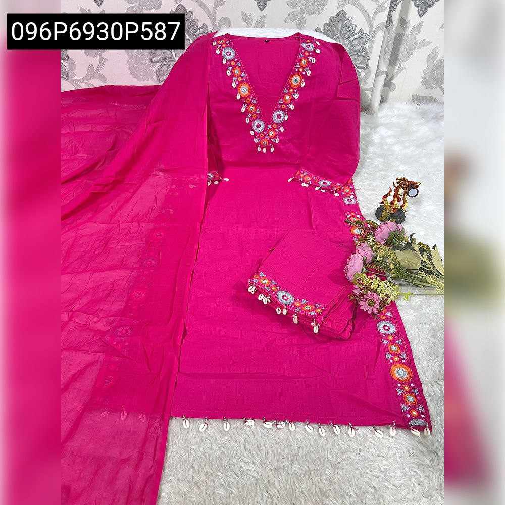 Comprehensive flat lay of TRENDBUY Pink Rani cotton embroidered suit set, showcasing the kurti, pants, and dupatta in full, with decorative elements on a white fuzzy background.