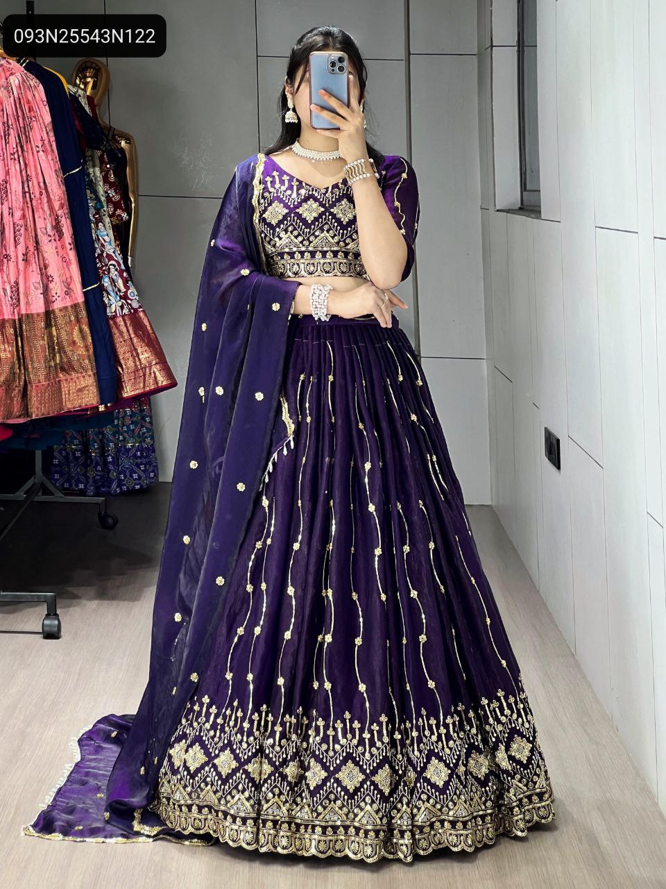 Full body view of a model showcasing the TRENDBUY violet beads embroidery lehenga choli, highlighting its luxurious Fendy Satin fabric and flowing flair.