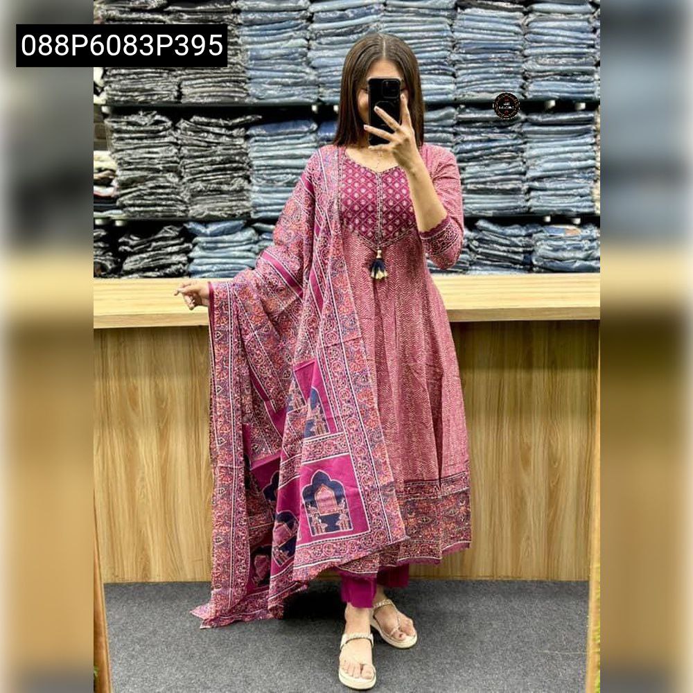 Full body view of a woman wearing a vibrant pink TRENDBUY Anarkali kurti set, highlighting intricate handwork on the yoke and a beautifully patterned malmal cotton dupatta.