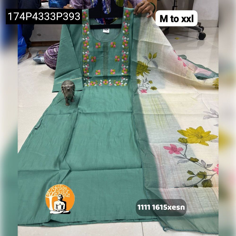 Teal Green Chanderi Maslin kurti with multi-color floral embroidery, paired with an off-white dupatta featuring large yellow and pink floral prints.